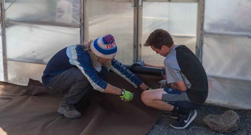 two teens engaged in a service project with outward bound